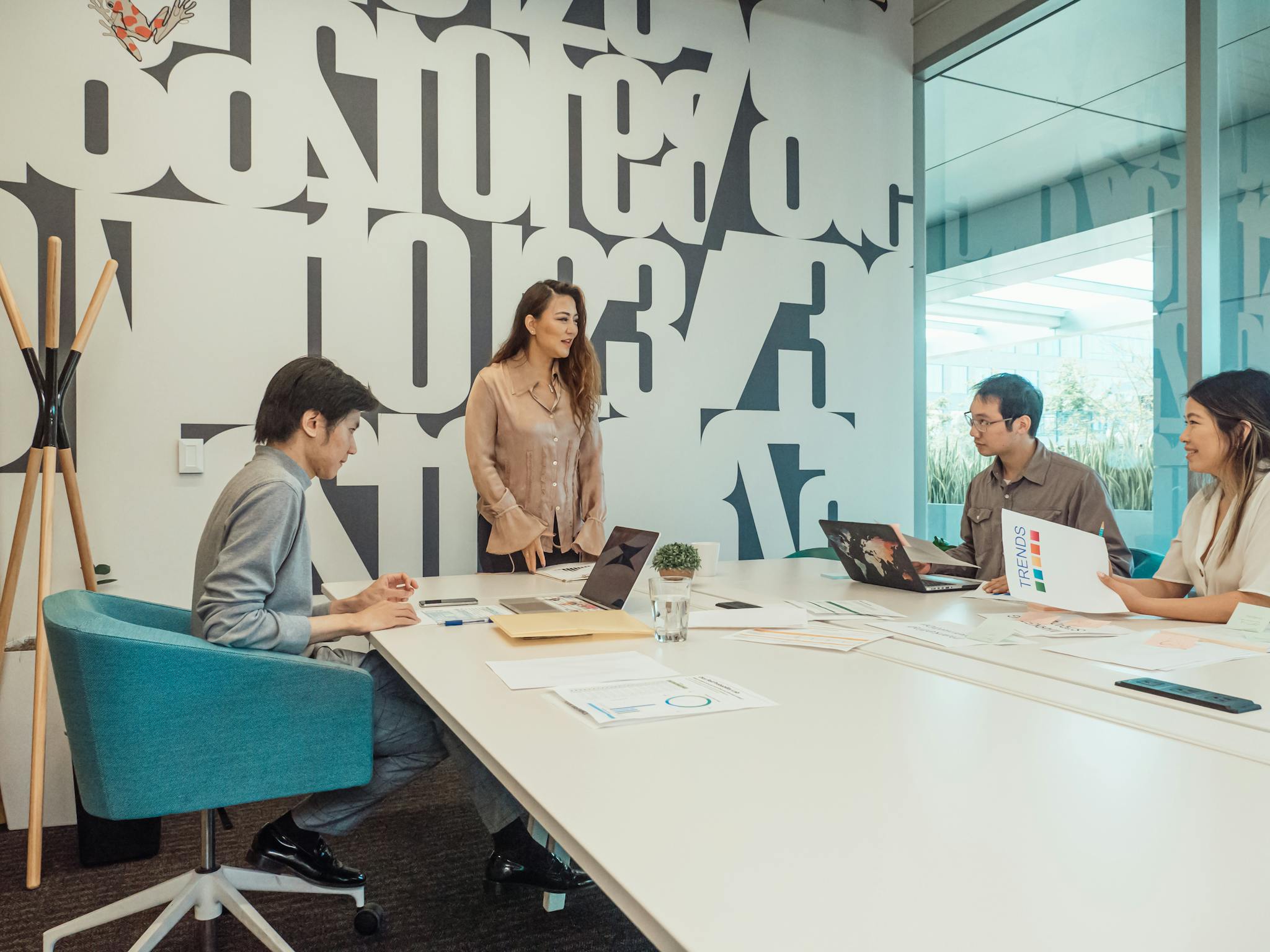 Diverse team engaged in brainstorming session in a modern office space.